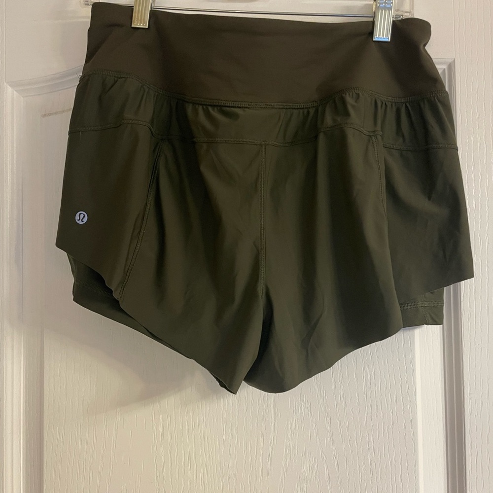 Olive green. Lululemon shorts. Size 10 never worn took tags off.